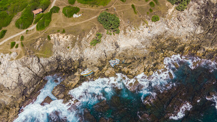 Tropical coast and ocean, drone shot, beautiful beach and water, tourist paradise.