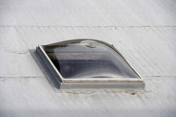 A skylight window in a flat roof seen from above