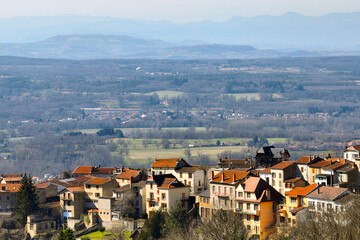 Fototapeta premium Aerial view of dense historic center of Thiers town in Puy-de-Dome department, Auvergne-Rhone-Alpes region in France. Rooftops of old buildings and narrow streets