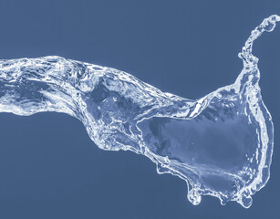 Water splash on a blue background. Reflection on the surface of the water.
