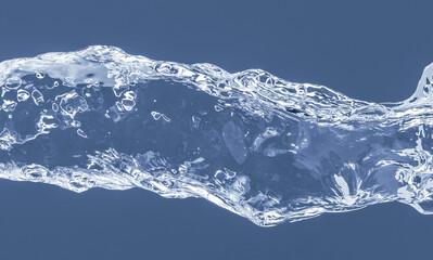 Fototapeta na wymiar Water splash on a blue background. Reflection on the surface of the water.