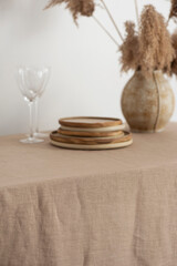 Home decor concept, table with beige tablecloth