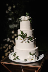 traditional white wedding cake with floral decoratoin
