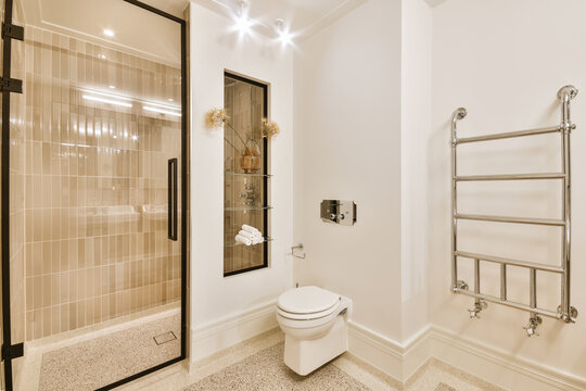 Interior of creative modern bathroom with shower cabin and balcony