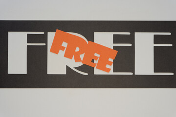 stencil with/and letters on paper - reads:  free