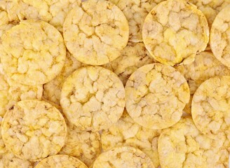 Organic corn crackers. Close up, background and texture. Full frame