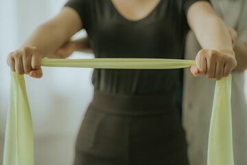 Physiotherapist is doing physical therapy for a patient, the patient has body aches due to overwork and has undergone treatment and physiotherapy with a professional physiotherapist.