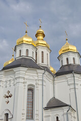 Fototapeta na wymiar Catherine's Church is a functioning church in Chernihiv, Ukraine. St. Catherine's Church was built in the Cossack period and is distinguished by its five gold domes in the Cossack Baroque style.