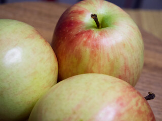Three ripe gala apples, a close-up shot. Fruits, macro photos.