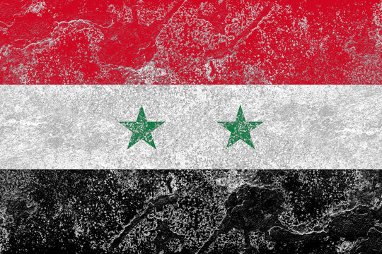 Syria flag on a rusty old iron metal sheet