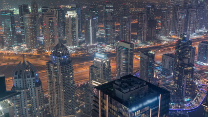 JLT and Dubai Marina skyscrapers intersected by Sheikh Zayed Road night timelapse