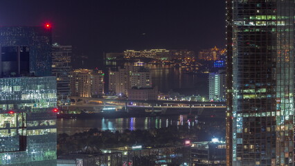 Fototapeta na wymiar Office buildings in Dubai Internet City and Media City district aerial night timelapse