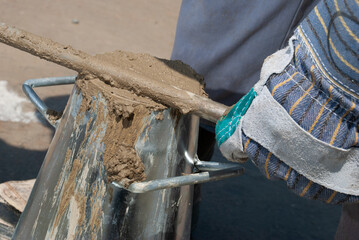 filling an abraham cone for a concrete slump test