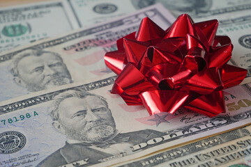stack of euro cash money and red bow background, money gift concept