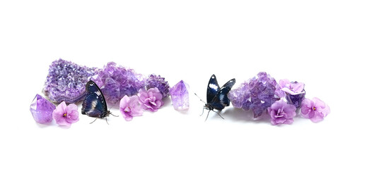 butterflies and Amethyst minerals set on white background. quartz gemstones for relaxation,...