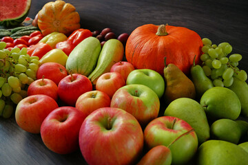 many different fruit and vegetables, green glocery shop, healthy fresh colored fruits and vegetables background delivery