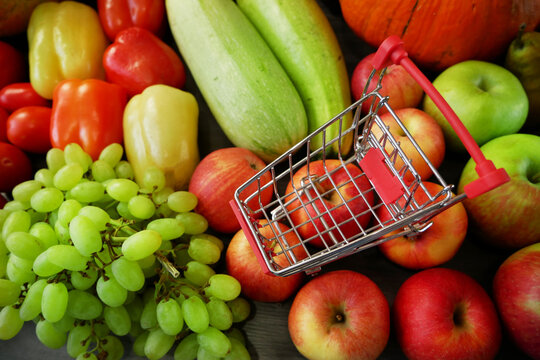 many different fruit and vegetables, green glocery shop, healthy fresh colored fruits and vegetables background delivery
