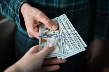 Man giving money to woman