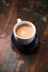Cup of coffee on rustic wooden background. Copy space.	