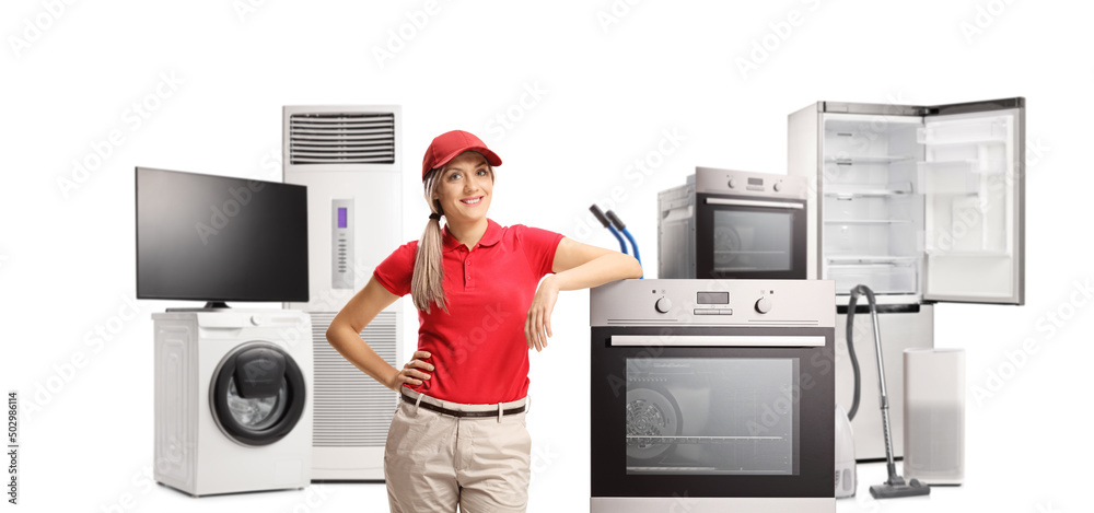 Poster Female sales assistant standing next to an electrcal oven and other appliances