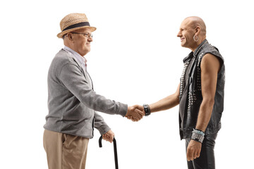 Senior with a wealking cane shaking hand with a bald punk