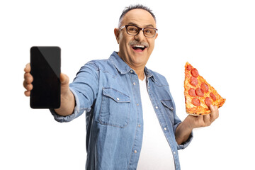 Cheerful mature man holding a slice of pepperoni pizza and showing a smartphone