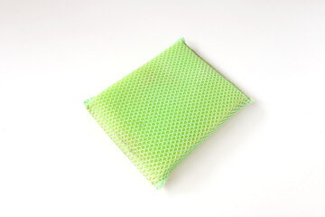Green washing sponge clean disc housework in kitchen, Isolated green sponge on white background. housekeeping equipment