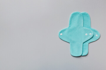 Fototapeta premium Eco-friendly reusable fabric women's pads. set of colorful bright reusable menstrual pads. zero waste woman periods concept top view with copy space