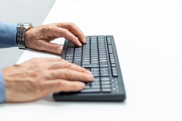 Close up of businessman hands typing on computer keyboard.Business, education, programming...