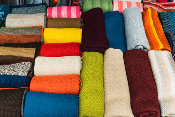 artisan blankets of different colors made by hand from alpaca fiber with ancestral designs and...