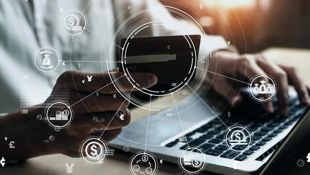 Young man use credit card for shopping payment online on laptop computer application or website. E-commerce and online shopping conceptual.