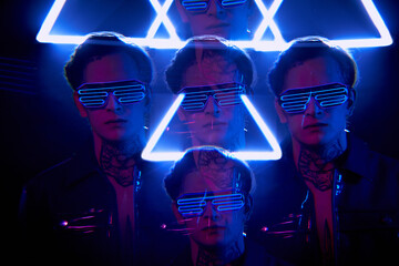 Repeating image of young man with tattoo on neck wearing flashing LED goggles in neon triangle light
