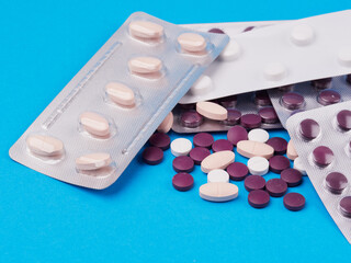 pharmaceutical over-the-counter or prescription pills, on a blue background
