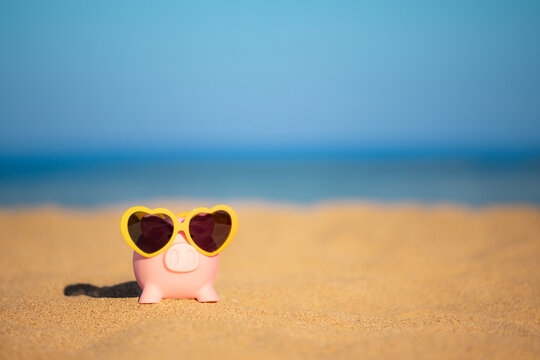 Piggybank on the beach in summer