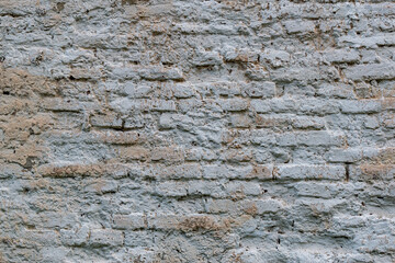 Old wall of mixed masonry, with a spray of lime.