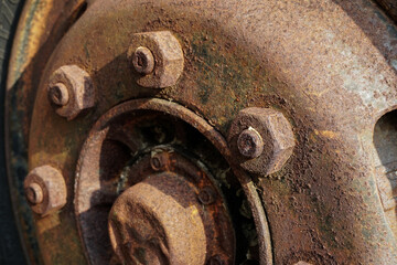 The wheels of an old truck rusted and corroded.