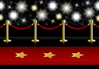 Red Carpet with poles and barrier rope in front of flash lights