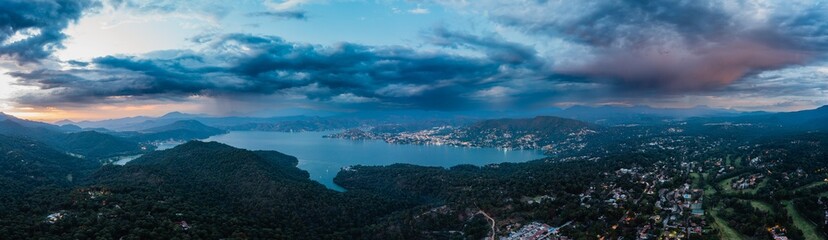 Fototapeta na wymiar High altitude aerial photography with the drone of Valle de Bravo lake at sunset from Avandaro