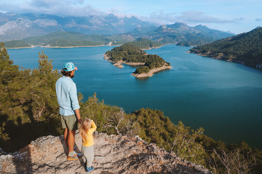 Dad and daughter traveling together family vacations walk outdoor active healthy lifestyle father with child enjoying aerial lake view