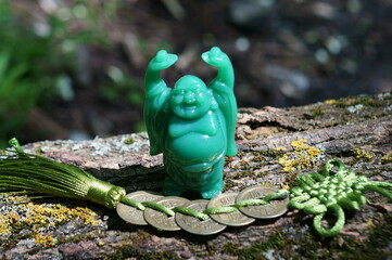 A Buddha figure and a bunch of Chinese coins.