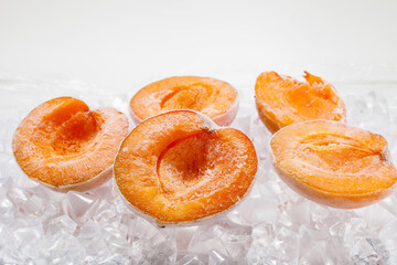 Fresh berries apricots on ice quick freezing