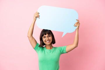 Youing woman holding an empty speech bubble - obrazy, fototapety, plakaty