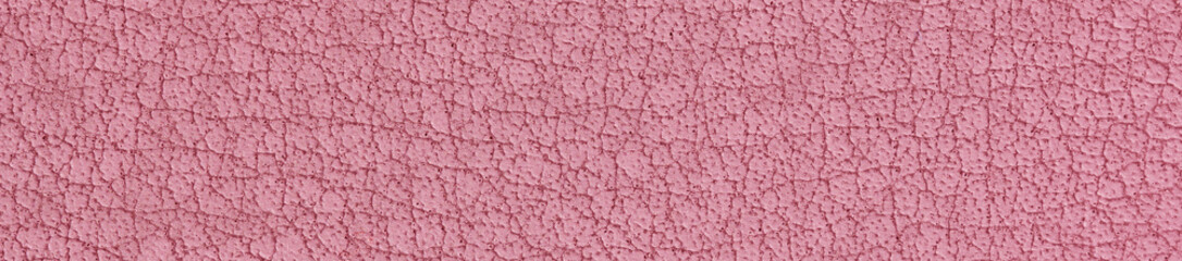 Fragment of modern fabric imitating leather. Pastel red-pink color. Nano-leather or eco-leather. Background. Macro. Web banner.