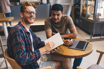 Multiracial business men working in office space