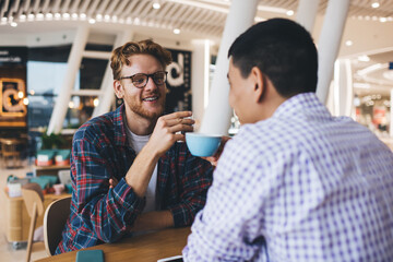 Multiracial business men working in office space