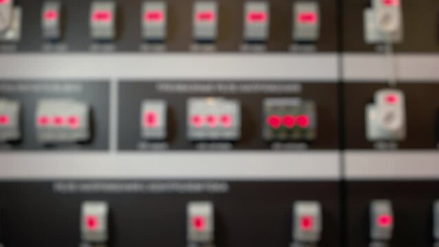 Many blurred voltage relays switchgear for background. Electronic factory equipment.