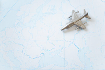 Fototapeta na wymiar Military toy plane on the background of the map of Ukraine. Concept