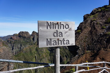 Wooden view point (miradouro) sign for Ninho de Manta on the spectacular hiking route from Pico do...