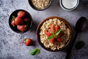 Oatmeal porridge with strawberries in a bowl
