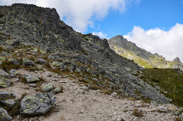 Fototapeta na wymiar Scenic view of sharp stoned slopes of the rocky mountains in National Park High Tatras, Slovakia 